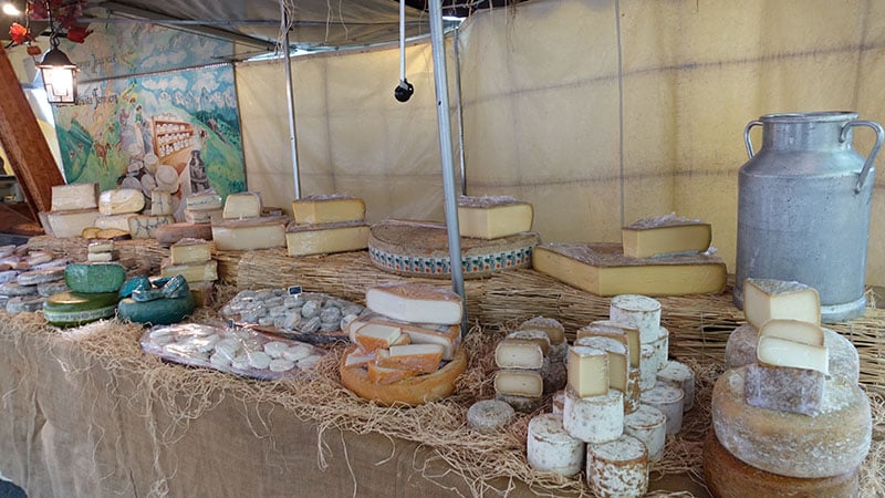 French cheeses on French market in Lyon, France
